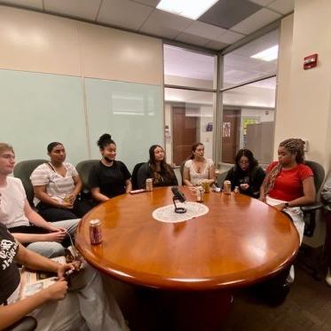 people setting around the table