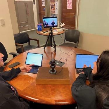 two women working on their laptops